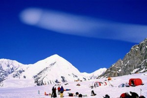 A curious cloud is seen over Kahiltna Base Camp.