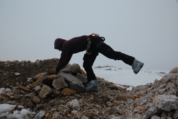 Scraping out a bivy at the base of the Stump