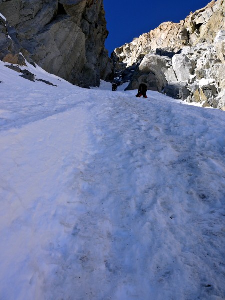 Pat Baumann and Kevin Trieu soloing the steep snow in the right couloi...