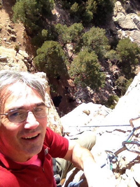 Man atop a bolted crack.