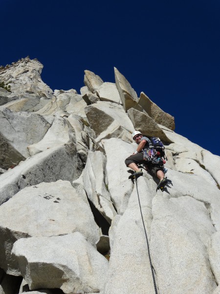 Geoff heading out on the direct start.  The move between the two flake...