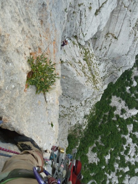 Looking down at Natalia back at the start of the amazing traverse pitc...