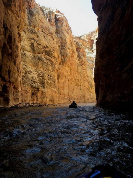 The author paddling into the darkness.