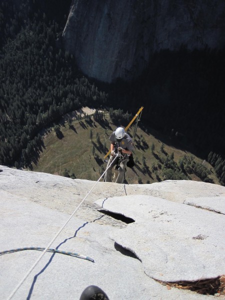 Jake making the first rappel the next day. From the anchors on the sla...